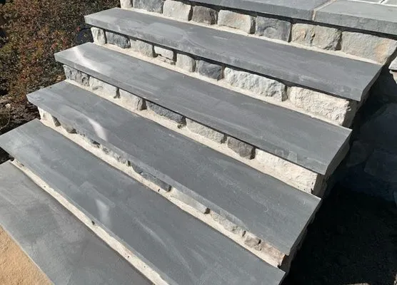 New granite entry steps with smooth stone treads